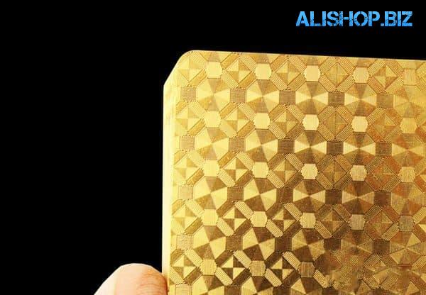 A set of playing cards in a gold design
